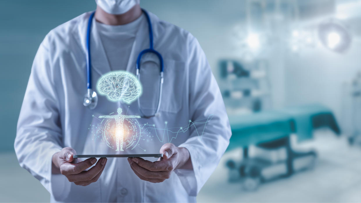 Doctor holding tablet showing brain human and body anatomy futuristic technology, innovative in science and medicine concept, technological digital futuristic.
