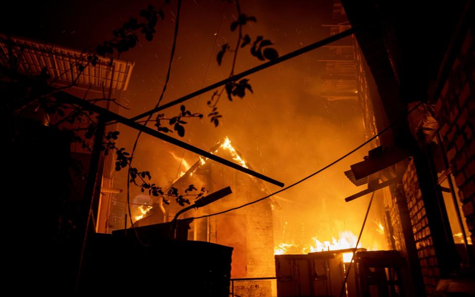 A huge fire engulfs buildings - AP Photo/Evgeniy Maloletka