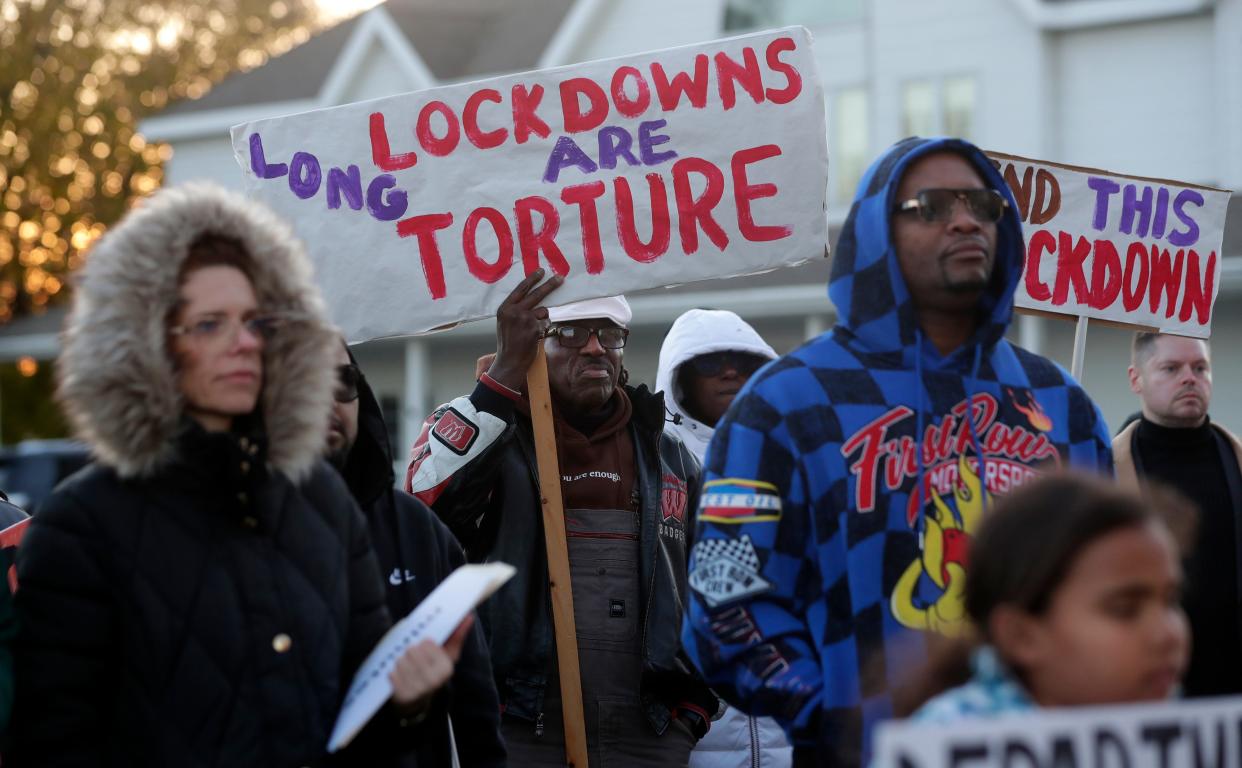 Dozens of people gather outside the Green Bay Correctional Institution on Nov. 9 to call for an end to the monthslong lockdown and the closure of the 125-year-old facility.