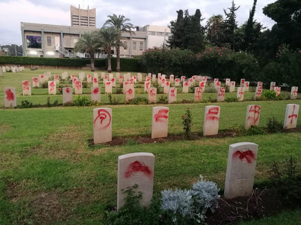 Dozens of Commonwealth graves that have been daubed with swastikas and other symbols at a cemetery dedicated to those who fought in the first and second world wars. Source: PA.