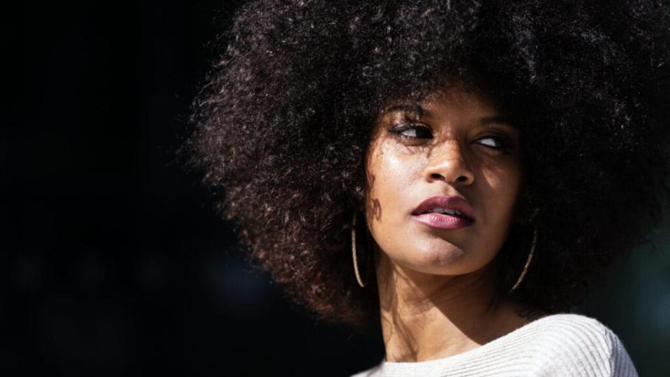 Black woman with natural hair, theGrio.com