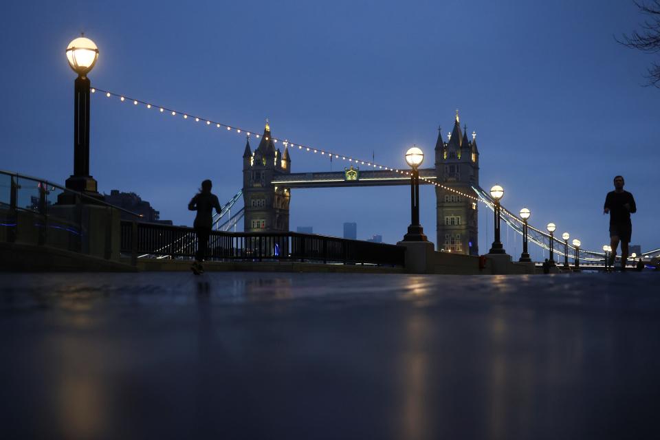 <p>A woman wears a face mask at a London Underground station</p> (REUTERS)