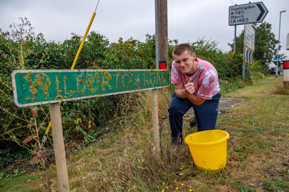 A teenage boy annoyed by road signs left dirty and hedges overgrown during lockdown has become a local hero after going on a mission to clean them all up. Joseph Beer, 15, noticed dozens of neglected street signs and hedgerows whilst out on his daily walks with mum Lisa, 52. He soon decided he wanted to clean up the streets - and with the help of dad Mark, 56, he rigged up a trailer to fix to the back of his bike, and started peddling around the streets near his house. Almost every day, Joseph, from Chatteris, Cambs., has headed off on his bike, towing a bucket of soapy water, some sponges, and garden tools, including hedgecutters and a rake, in the trailer.

His efforts have seen him clean up street name signs that have been left almost unreadable due to moss growing over them, such as Wilburton Road in nearby Ely.