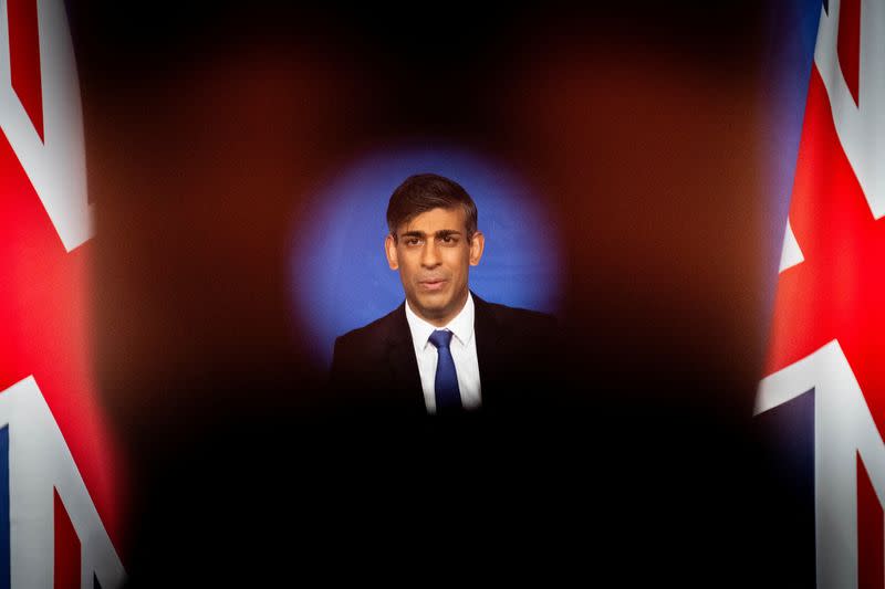 Rishi Sunak attends a press conference in the Downing Street Briefing Room