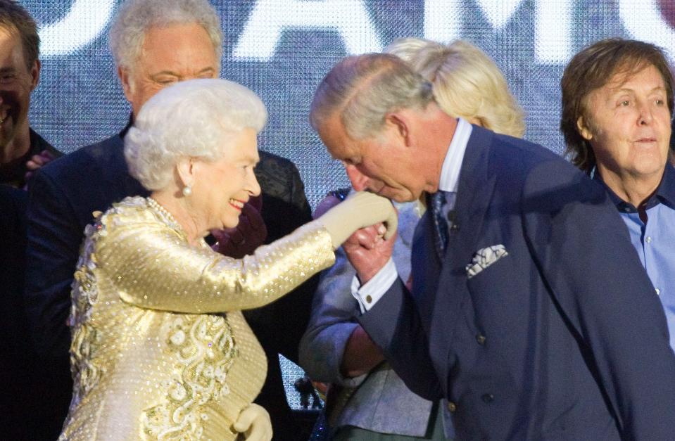 Prince Charles kisses Queen Elizabeth's hand at the 2012 Diamond Jubilee Concert