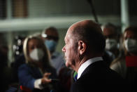 Olaf Scholz, Federal Minister of Finance, and SPD top candidate for chancellor at the forthcoming elections, speaks to journalists after the hearing before the Bundestag Finance Committee in Berlin, Germany, Monday, Sept. 20, 2021. Scholz was to answer questions about the search of his ministry in connection with money laundering investigations. (Carsten Koall/dpa via AP)