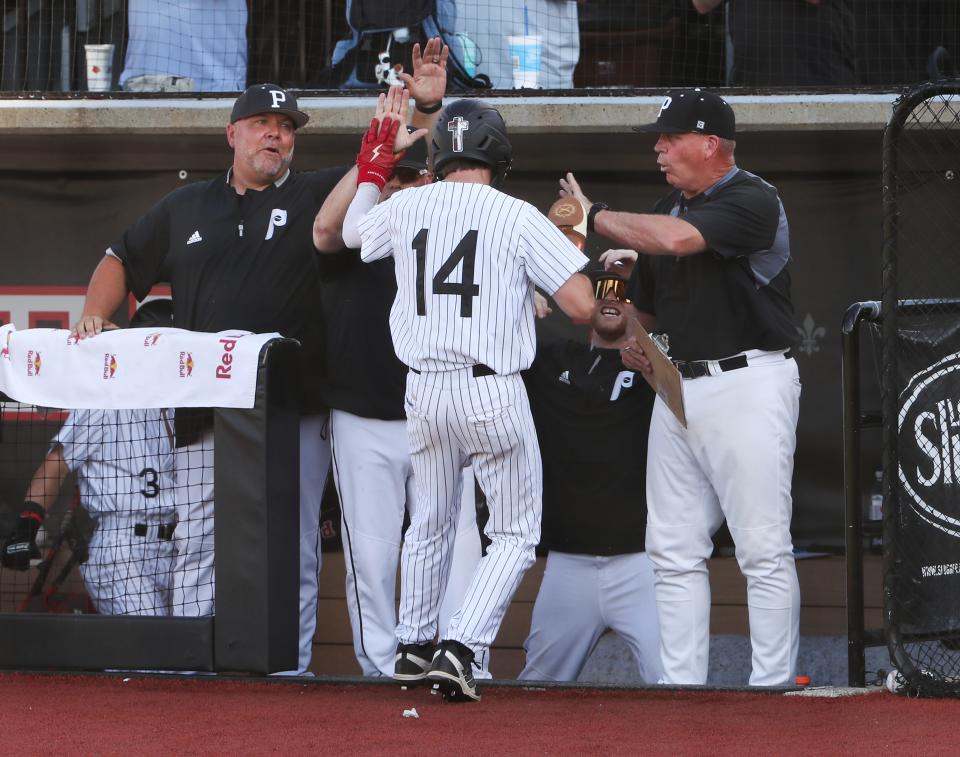 PRP celebrated after Brayden Bruner (14) scored a run against North Bullitt during the 6th Region baseball semifinals at U of L's Jim Patterson Stadium in Louisville, Ky. on May. 28, 2024.