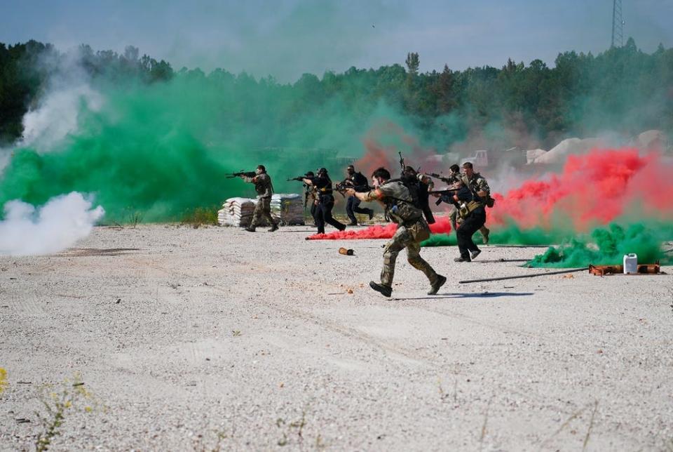 Special Forces candidates assigned to the U.S. Army John F. Kennedy Special Warfare Center and School assault enemy role players as they take part in the final phase of field training known as Robin Sage in central North Carolina, Sept. 28, 2021. The exercise for soldiers in the Special Forces qualification course will be held again from Jan. 22, 2022, to Feb. 4, 2022, across 25 North Carolina counties.