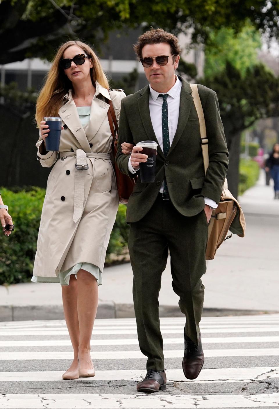 Danny Masterson, right, and his wife Bijou Phillips arrive for closing arguments in his second trial in Los Angeles on May 16, 2023.
