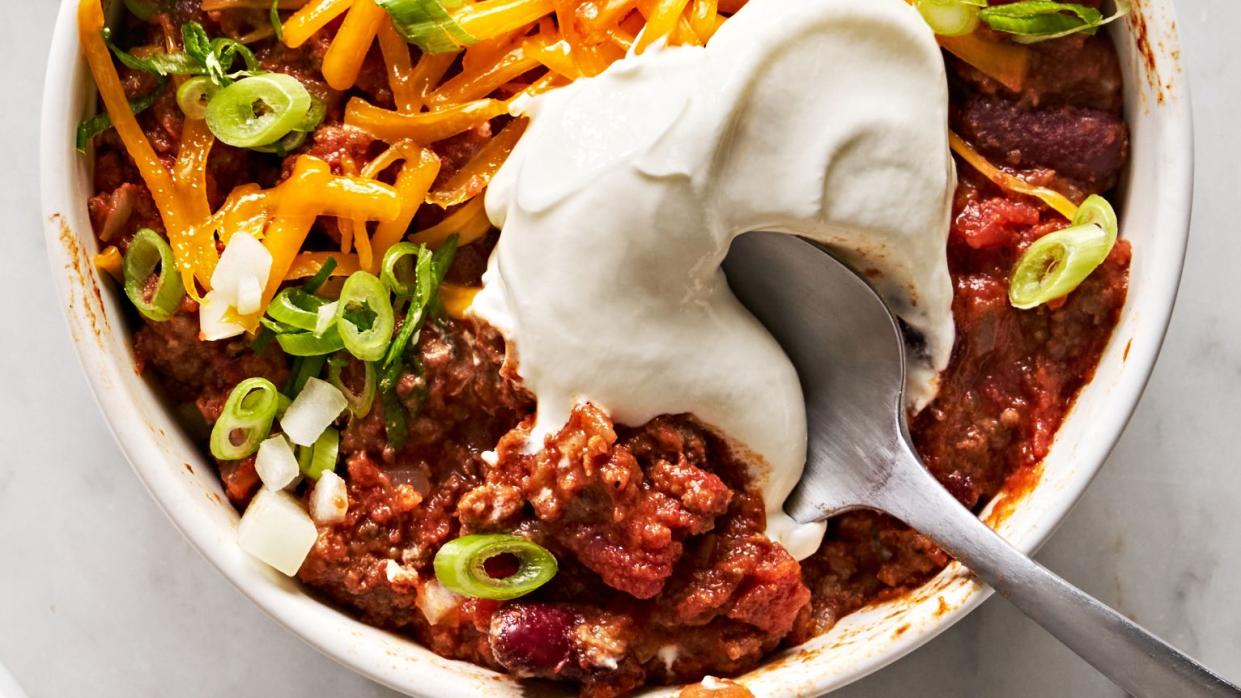 classic beef chili with sour cream and toppings