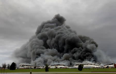 Nearly 200 firefighters battle a massive five-alarm fire at in building six General Electric Appliance Park in Louisville, Kentucky, April 3, 2015. REUTERS/ John Sommers II