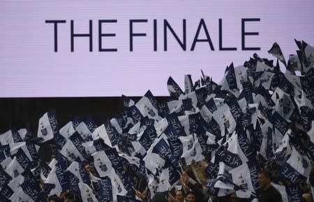 Britain Soccer Football - Tottenham Hotspur v Manchester United - Premier League - White Hart Lane - 14/5/17 Tottenham fans wave flags as a message is displayed on the big screen Reuters / Dylan Martinez Livepic