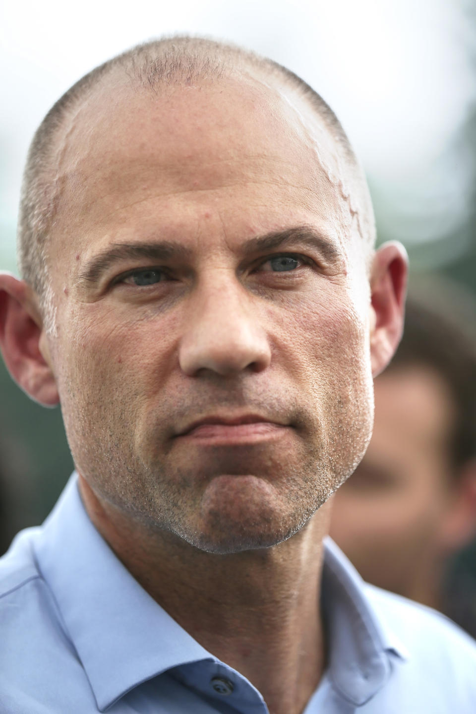 Michael Avenatti, an attorney and entrepreneur, talks to the press after speaking at the Hillsborough County Democrats' Summer Picnic fundraiser in Greenfield, N.H. Sunday, Aug.19, 2018. Avenatti, the attorney taking on President Donald Trump over his alleged affair with an adult film actress, is exploring a possible 2020 run for president. (AP Photo/ Cheryl Senter)