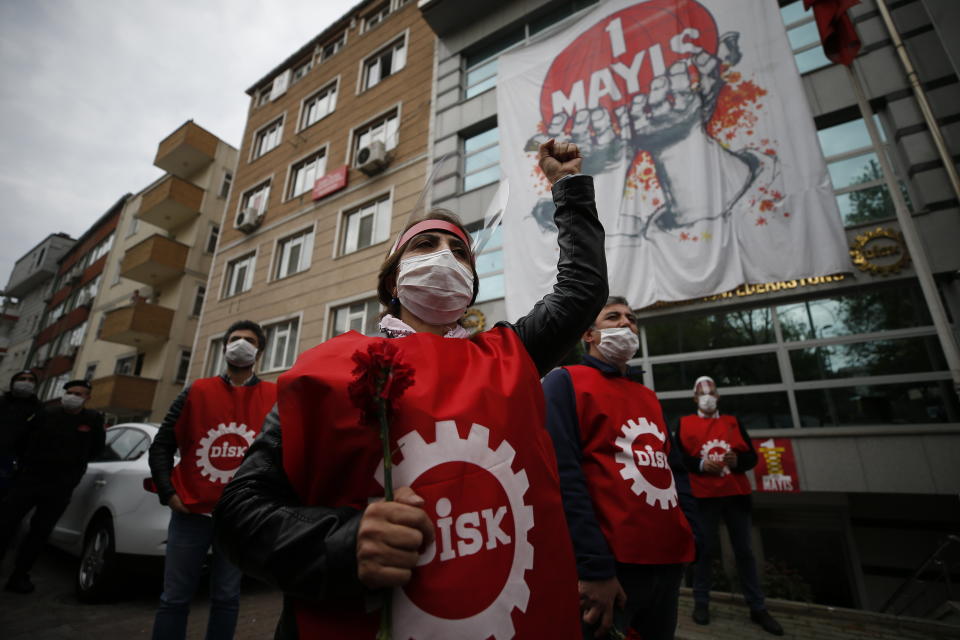 A demonstrator, wearing a face mask and shield for protection againstcoronavirus, chants slogans during May Day protests in Istanbul, Friday, May 1, 2020. Police in Istanbul detained several demonstrators who tried to march toward Istanbul’s symbolic Taksim Square in defiance of the lockdown imposed by the government due to the coronavirus outbreak. (AP Photo/Emrah Gurel)
