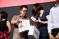 Customers unboxing their new iPhones. (Photo: Sharlene Sankaran / Yahoo Newsroom)