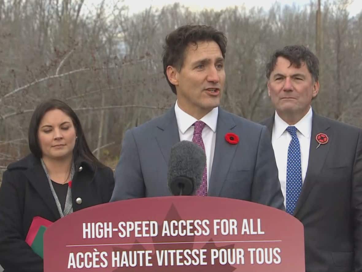 Prime Minister Justin Trudeau referred to a tax cut by Premier Blaine Higgs as coming from 'failed trickle-down theories.' He spoke at a news conference in Oromocto with Fredericton MP Jenica Atwin, left, and Intergovernmental Affairs, Infrastructure and Communities Dominic LeBlanc. (Pat Richard/CBC - image credit)
