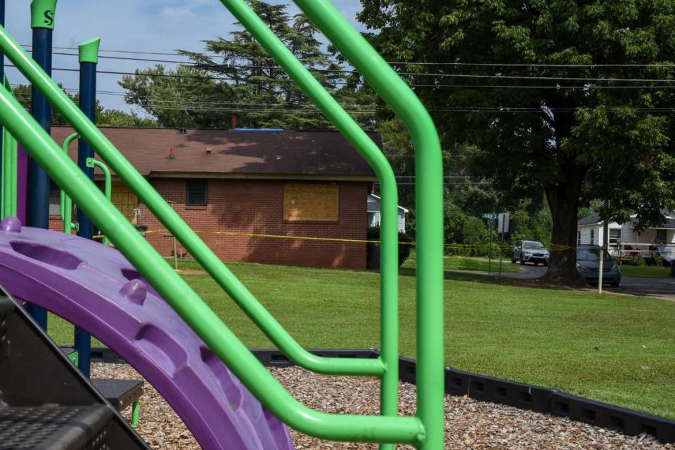 An empty playground sits behind a unit that caught fire in Concord, N.C., on Sunday, Aug. 20, 2023. Three children died inside the unit, which is owned and maintained by the city.