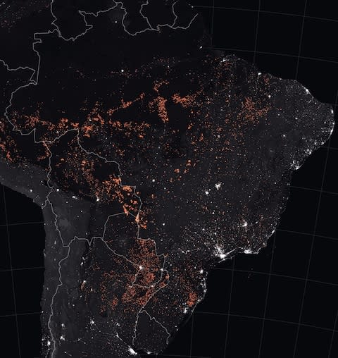 NASA Earth Observatory map shows active fire detections in South America - Credit: AFP