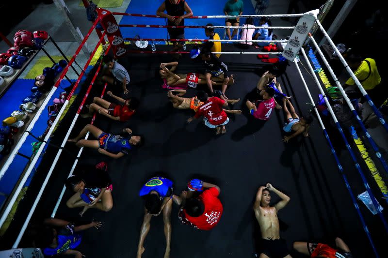 The Wider Image: Punching out of poverty: Despite risks, nine-year-old Thai fighter eager to return to ring