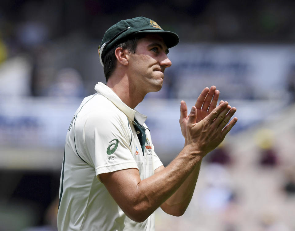 Australia's Pat Cummins thanks the crowd after capturing 5 wickets against New Zealand during their cricket test match in Melbourne, Australia, Saturday, Dec. 28, 2019. (AP Photo/Andy Brownbill)