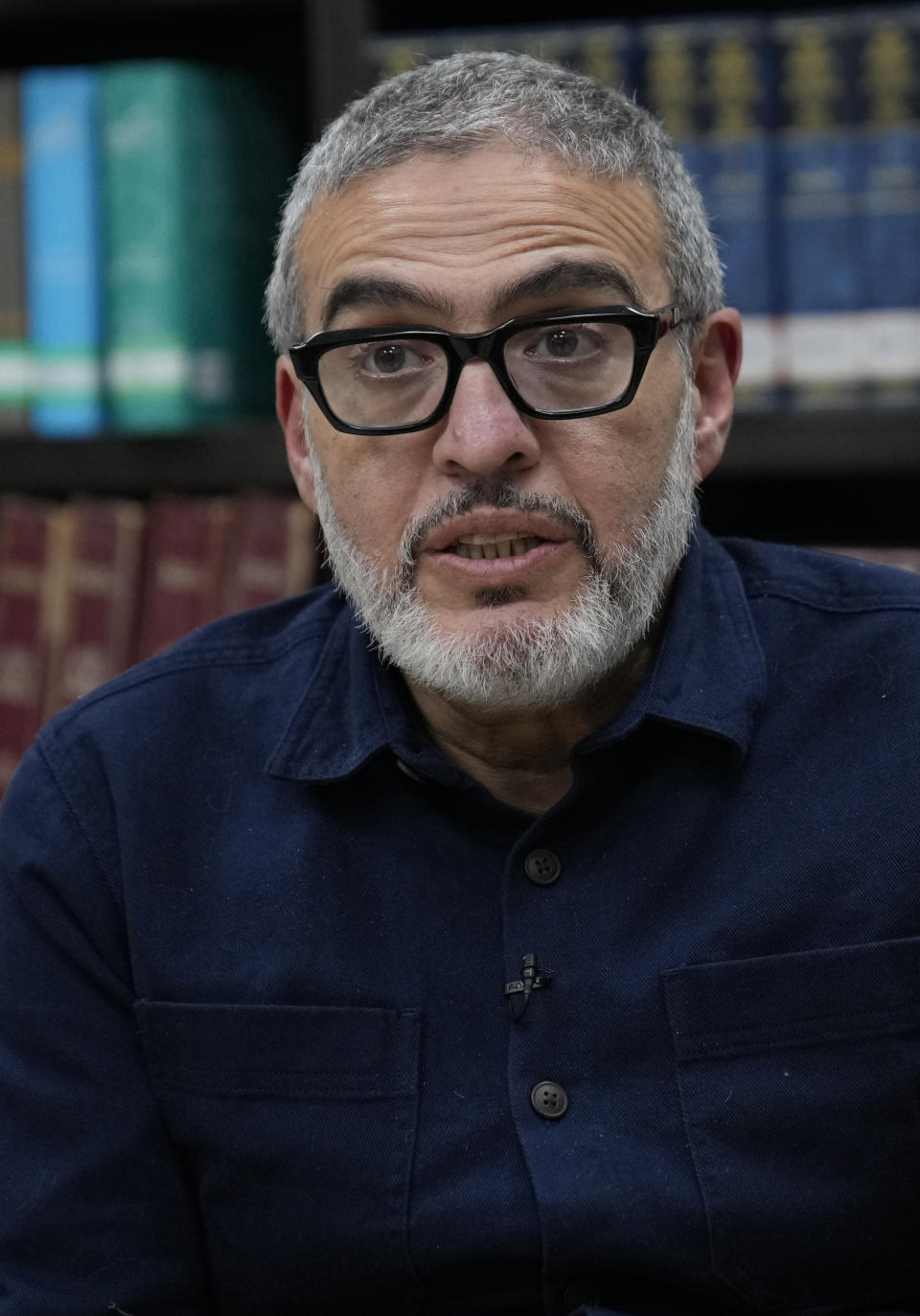 Doctor Ghassan Abu Sitta, a Palestinian-British plastic surgeon specializing in conflict medicine, speaks during an interview with The Associated Press at the Institute for Palestine Studies in Beirut, Lebanon, Saturday, Dec. 9, 2023. Abu Sitta who spent weeks in the Gaza Strip during the current Israel-Hamas war in the enclave as part of a Doctors Without Borders medical team said he has given testimony to a British war crimes investigation unit. (AP Photo/Hussein Malla)