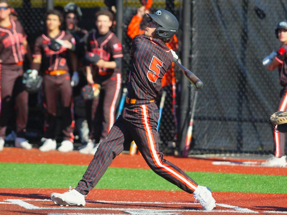 Taunton's Andrew Cali makes contact during a Hockomock League game against Attleboro.