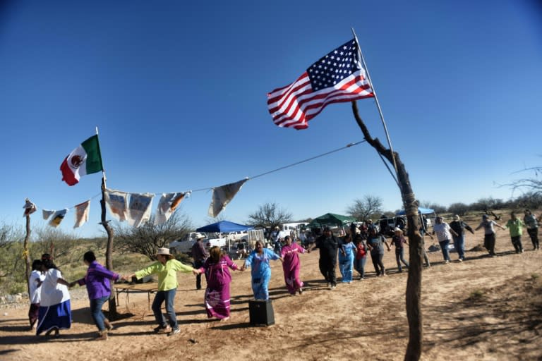 Indigenous people from the Tohono O'odham ethnic group perform a protest against US President Donald Trump's intention to build a new wall between Mexico and United States, in Sonora, northern Mexico