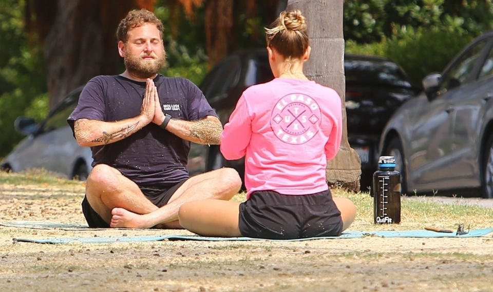 <p>Jonah Hill meditates during an outdoor yoga session in Santa Monica on Monday. </p>