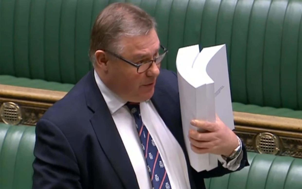 Mark Francois holds up his copy of the trade agreement in the House of Commons - Getty Images