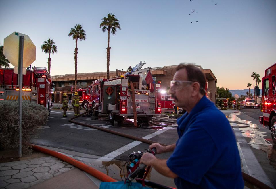 Fire crews from multiple agencies respond to a fire at a commercial building at 73-350 El Paseo in Palm Desert, Calif., Tuesday, Nov. 15, 2022. The fire was reported at 3:04 p.m. at the second story of Desert Luxury Estates, a vacation home rental agency office. CalFire said there were no reported injuries and the fire was contained at 4:30 p.m. 