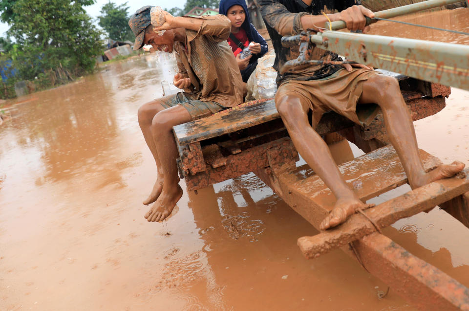 <p>A man washes his face during the flood after the Xepian-Xe Nam Noy hydropower dam collapsed in Attapeu province, Laos, July 26, 2018. (Photo: Soe Zeya Tun/Reuters) </p>