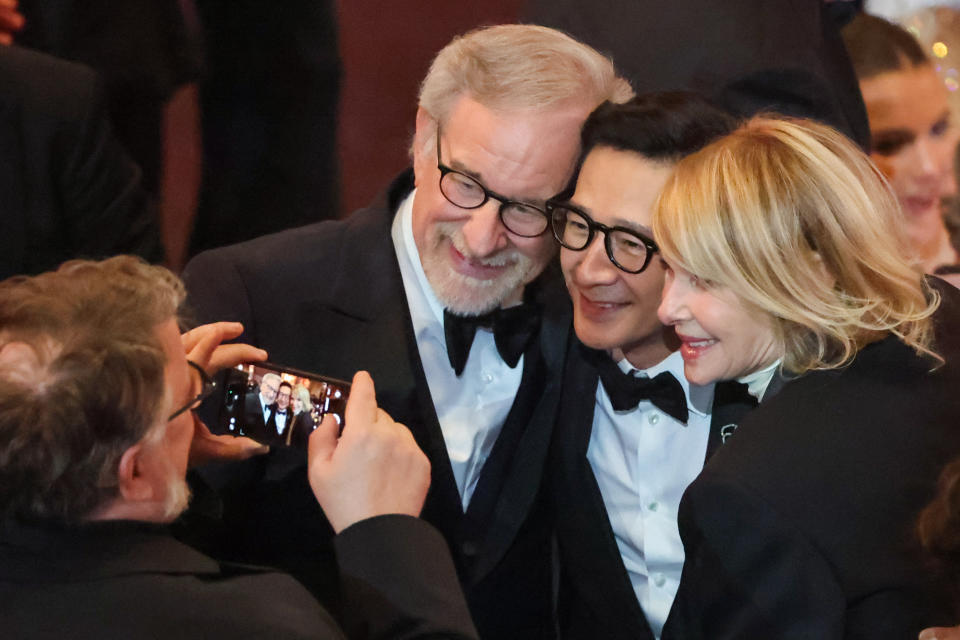 HOLLYWOOD, CA - MARCH 12: Ke Huy Quan with Steven Spielberg and Kate Capshaw at the 95th Academy Awards in the Dolby Theatre on March 12, 2023 in Hollywood, California. (Myung J. Chun / Los Angeles Times via Getty Images)