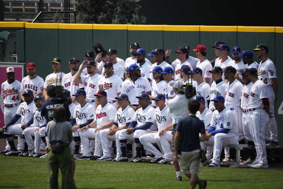 The American League baseball All Stars pose for a team picture in centerfield at Coors Field, Monday, July 12, 2021, in Denver. (AP Photo/David Zalubowski)