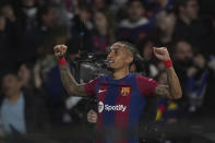 Barcelona's Raphinha celebrates after scoring his side's opening goal during the Champions League quarterfinal second leg soccer match between Barcelona and Paris Saint-Germain at the Olimpic Lluis Companys stadium in Barcelona, Spain, Tuesday, April 16, 2024. (AP Photo/Emilio Morenatti)