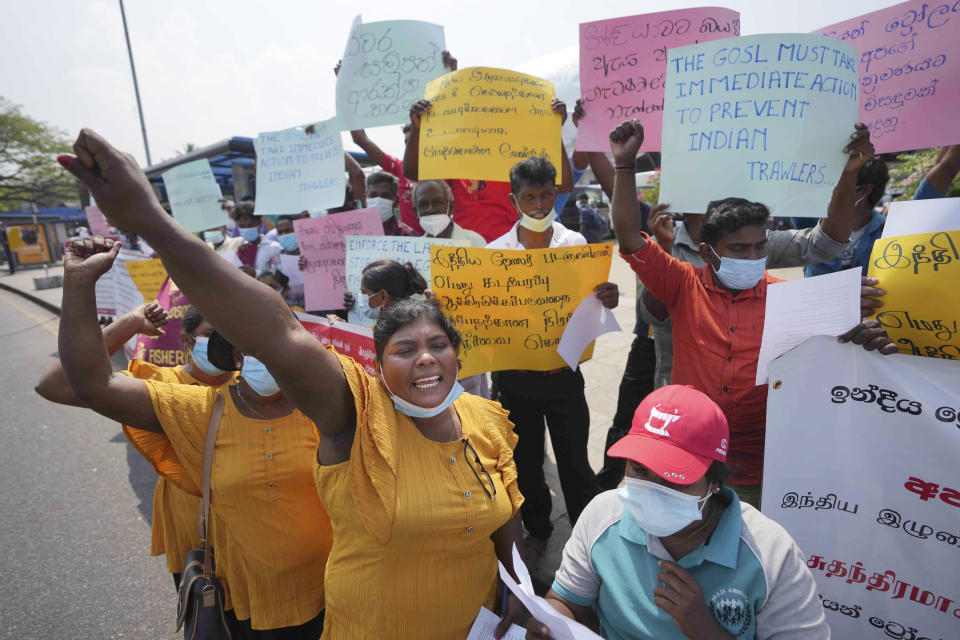 FILE - Members of the fishing community shout slogans during a protest in Colombo, Sri Lanka, Wednesday, Feb. 23, 2022, to demand that the Sri Lankan government act to curb illegal fishing and poaching of marine resources by Indian fishermen in Sri Lankan waters. (AP Photo/Eranga Jayawardena, File)