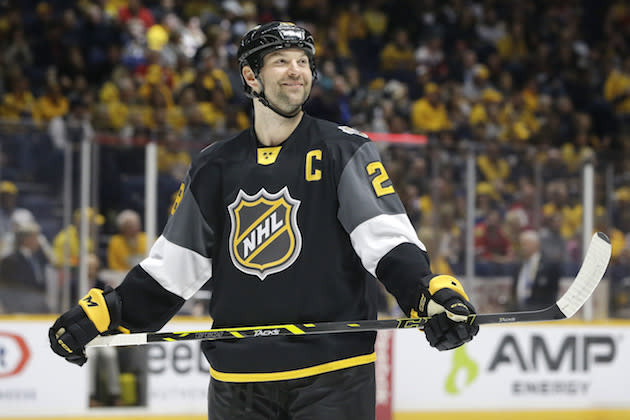 FILE - In this Jan. 31, 2016, file photo, Pacific Division forward John Scott looks into the stands during the NHL hockey All-Star championship game against the Atlantic Division, in Nashville, Tenn. The NHL is taking steps to avoid another John Scott situation at the All-Star Game. The league on Monday. Nov. 21, 2016, announced new fan voting rules that disqualify players from being named All-Star captains if they’re injured or sent to the American Hockey League. Scott, a journeyman enforcer, was voted in by fans last year when he was with the Arizona Coyotes and still served as the Pacific Division captain despite being traded to the Montreal Canadiens and demoted to the AHL. (AP Photo/Mark Humphrey, File)