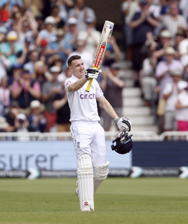 Harry Brook raises his bat into the air as he celebrates his century (