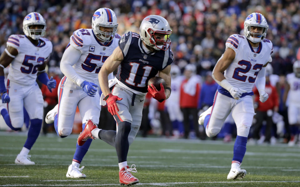 Julian Edelman scores, as the Patriots clinched another AFC East title. (AP)