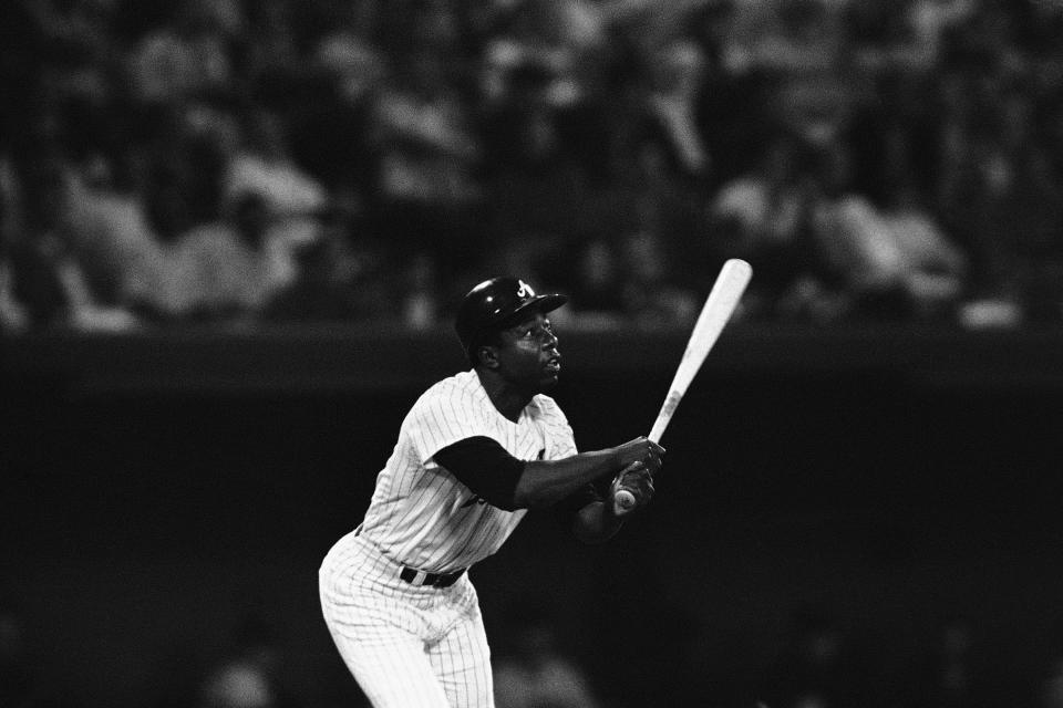 FILE - In this April 27, 1971, file photo, Atlanta Braves' Hank Aaron watches as his 600th major league home run during third inning of National League game against San Francisco in Atlanta. Hank Aaron, who endured racist threats with stoic dignity during his pursuit of Babe Ruth but went on to break the career home run record in the pre-steroids era, died early Friday, Jan. 22, 2021. He was 86. The Atlanta Braves said Aaron died peacefully in his sleep. No cause of death was given. (AP Photo/Jack Harris, File)