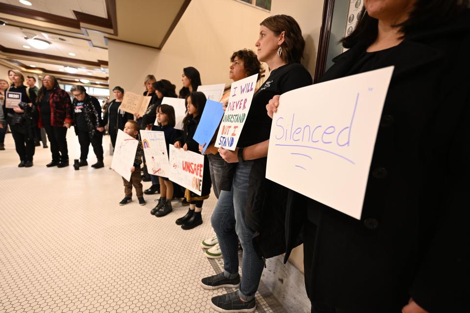 A small group gathered outside the committee room to protest agains HB261 prior to Senate members of the Education Standing Committee hearing comments on HB261 at the Capitol in Salt Lake City on Monday, Jan. 22, 2024. The bill received a favorable recommendation. | Scott G Winterton, Deseret News