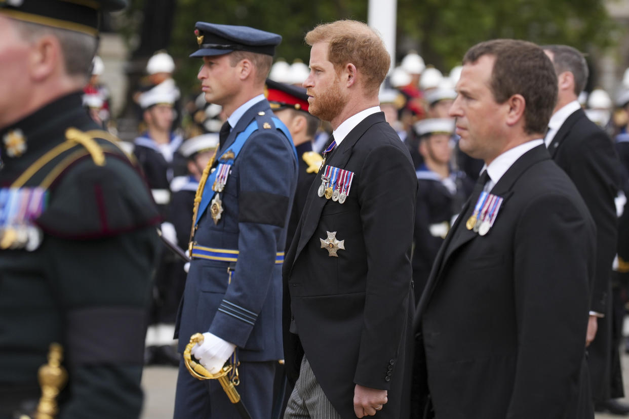 LONDON, ENGLAND - SEPTEMBER 19: Prince William, Prince of Wales and Prince Harry, Duke of Sussex follow a gun carriage carrying the coffin of Queen Elizabeth II during the State Funeral of Queen Elizabeth II at Westminster Abbey on September 19, 2022 in London, England. Elizabeth Alexandra Mary Windsor was born in Bruton Street, Mayfair, London on 21 April 1926. She married Prince Philip in 1947 and ascended the throne of the United Kingdom and Commonwealth on 6 February 1952 after the death of her Father, King George VI. Queen Elizabeth II died at Balmoral Castle in Scotland on September 8, 2022, and is succeeded by her eldest son, King Charles III. (Photo by Emilio Morenatti - WPA Pool/Getty Images)