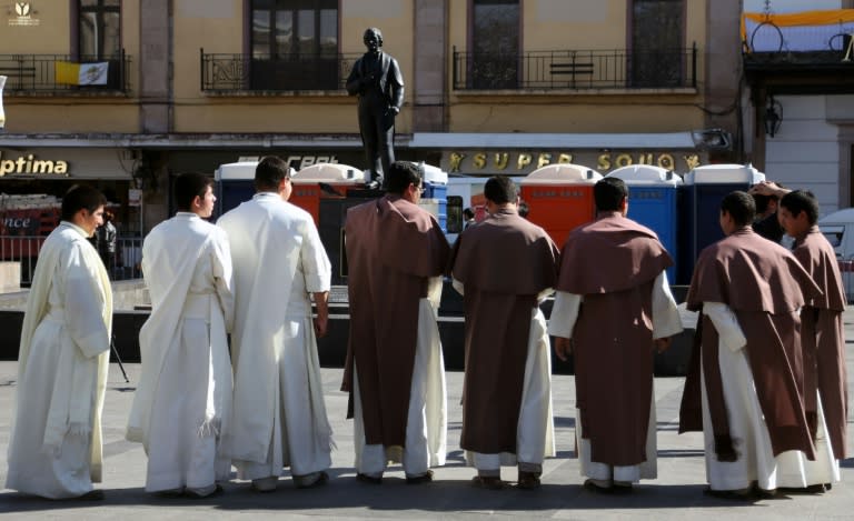 A group of Catholic seminarians stand near the cathedral of Morelia, Michoacan State, Mexico on February 15, 2016