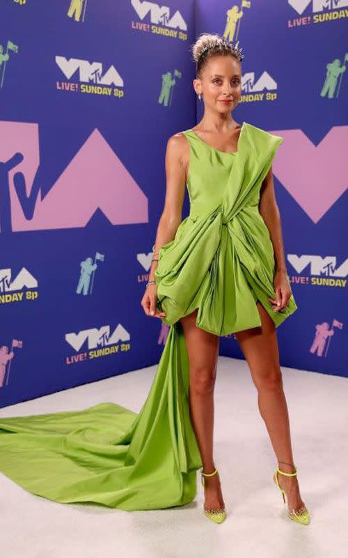 <p>Nicole Richie could wear a bag and we'd be excited to see her, but this lime green Cong Tri dress is a dream. </p>