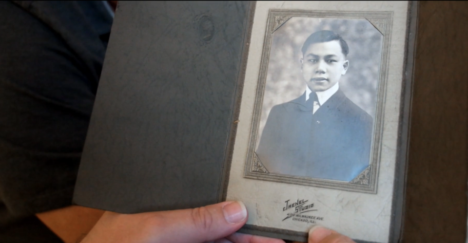 A black and white picture of Fang Lang, one of the six Chinese men, dressed in a suit and tie. 