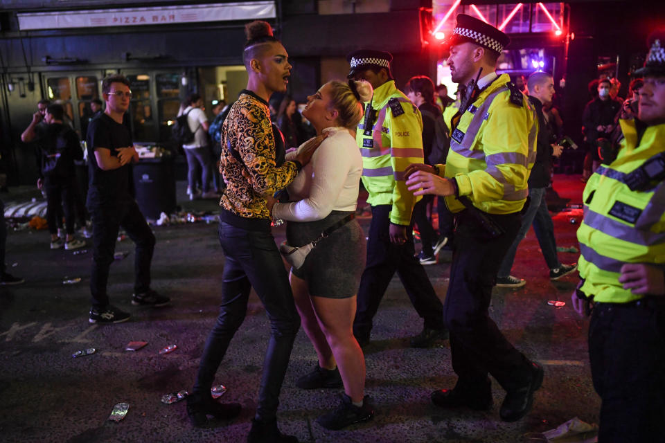 LONDON, ENGLAND - JULY 04: Police officers are seen breaking up a fight outside a pub in Soho on July 4, 2020 in London, United Kingdom. The UK Government announced that Pubs, Hotels and Restaurants can open from Saturday, July 4th providing they follow guidelines on social distancing and sanitising. (Photo by Peter Summers/Getty Images)