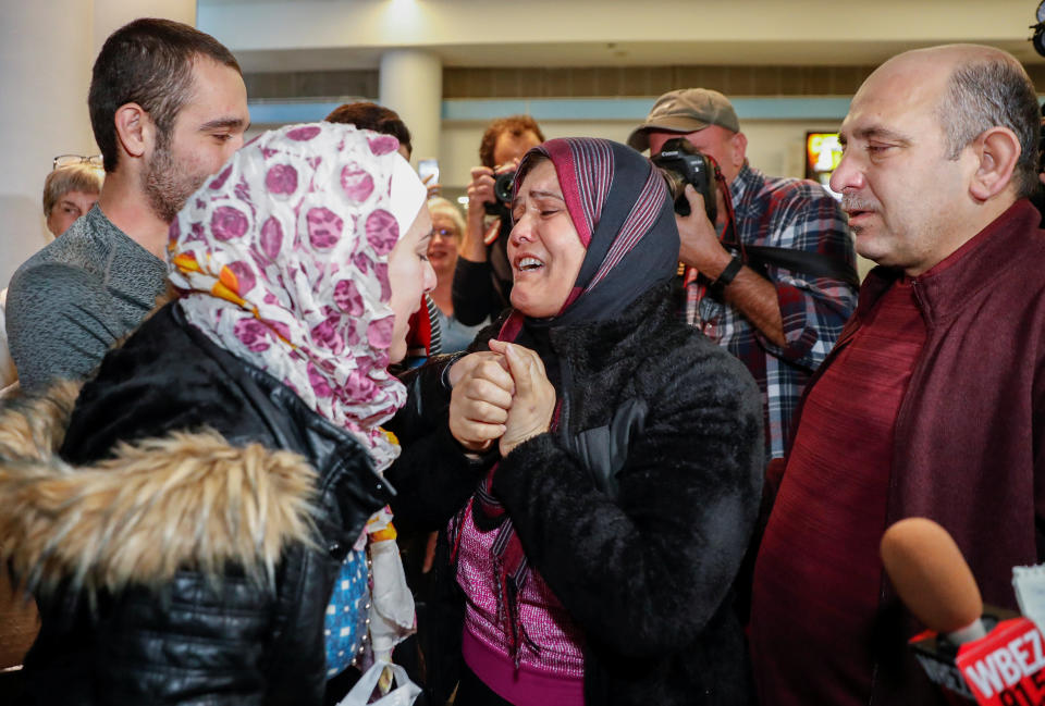 Syrian refugee Baraa Haj Khalaf (left) reacts as&nbsp;she is welcomed by her&nbsp;mother and father at O'Hare International Airport in Chicago&nbsp;last February. (Photo: Kamil Krzaczynski / Reuters)