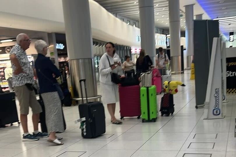 Passengers at Manchester Airport waiting for transport back to East Midlands -Credit:Submitted