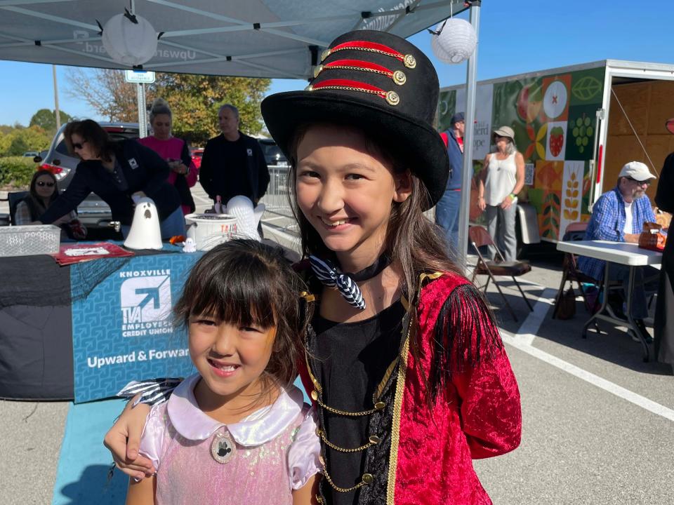 Gabby Grasco, 5, and Olivia Grasco, 11, dressed as Mini Mouse and Taylor Swift at the third annual Farragut Harvest Festival at Village Green Shopping Center, Oct. 22, 2023.