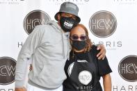 <p>T.I. poses with his mom, Violeta Morgan, on Tuesday at the Harris Community Works 15th Annual Turkey Giveaway at Jackson Memorial Baptist Church in Atlanta.</p>