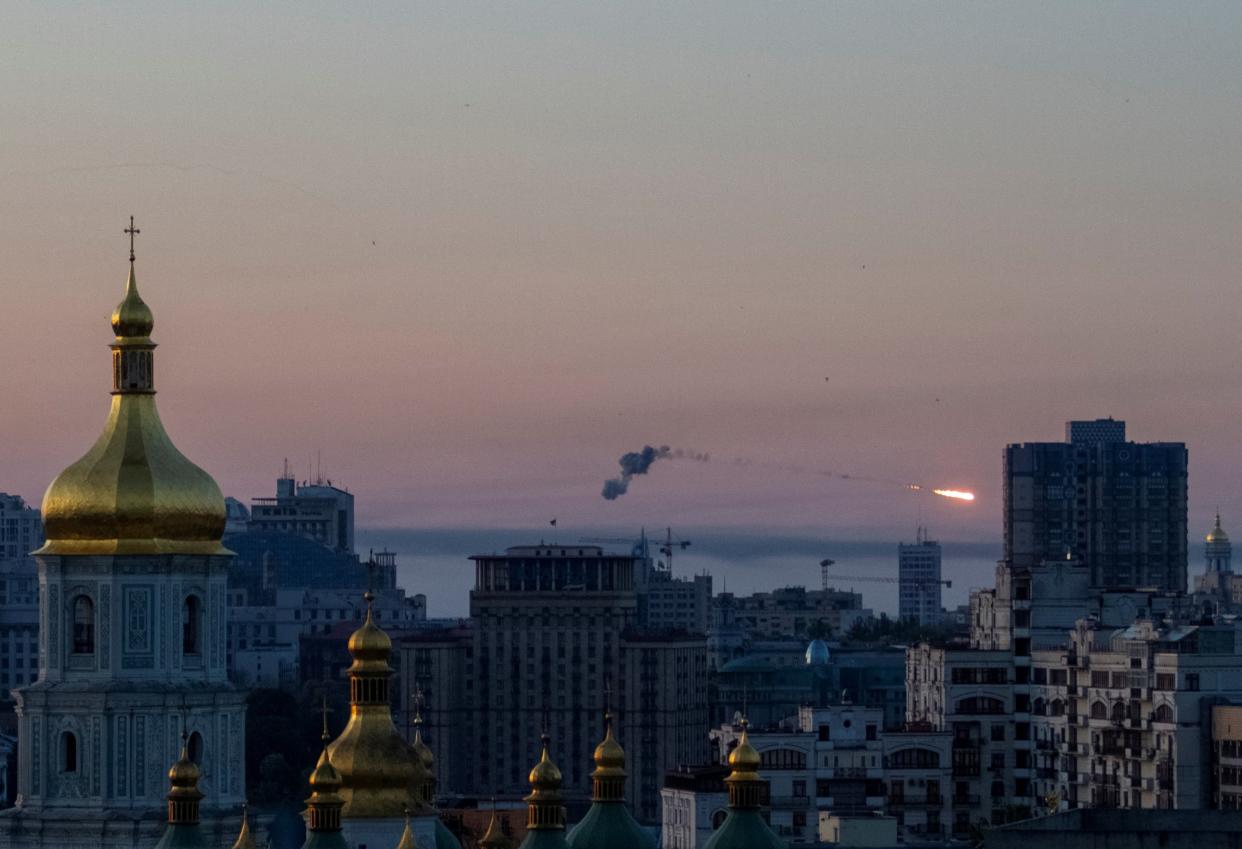 An explosion of a missile is seen in the sky over the city during a Russian missile strike, amid Russia's attack on Ukraine, in Kyiv (REUTERS)